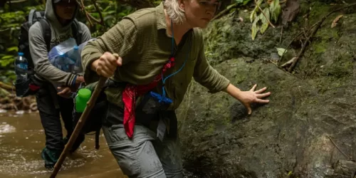 Aimee traveling through the Annamites with the Saola Foundation team along rivers and difficult terrain.