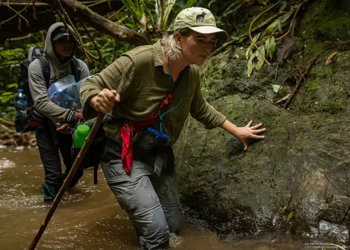 Aimee traveling through the Annamites with the Saola Foundation team along rivers and difficult terrain.